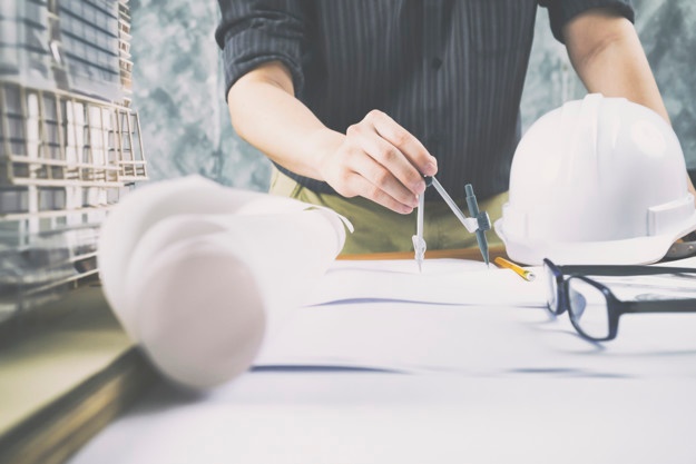 architect-or-engineer-working-in-office-construction-concept_1421-146.jpg